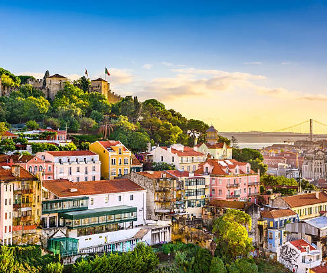 Lisbon, Portugal old town cityscape at dusk.